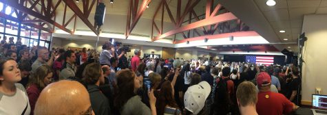 Attendees stand close in Heritage Hall for former President Bill Clinton's speech.