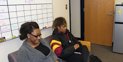 Programming Board officers Ogechi Duru (left) and Dana Dyer (right) have a discussion at the club’s weekly meeting.