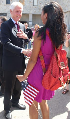 Freshman Ashley Thompson shakes hands with former President Bill Clinton outside of the Living / Learning Center.