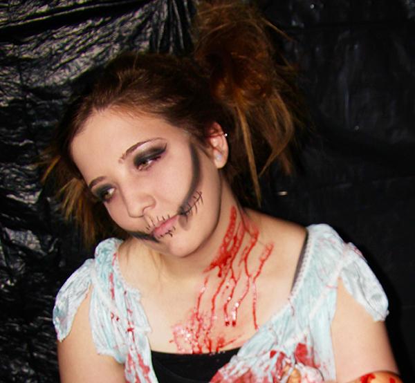 Sophomore Shelby Zastawa, a Phi Sigma Sigma sister, dresses up as a doll for the sorority’s themed haunted house.