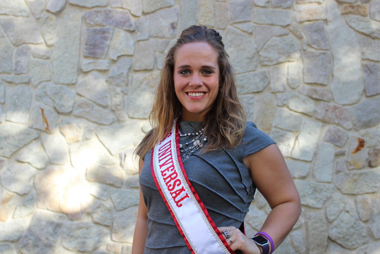 Kristina Marinkovich, Pitt-Johnstown’s international student services coordinator, poses while wearing her Ms. Universal sash. She was crowned Sept. 8 in London.