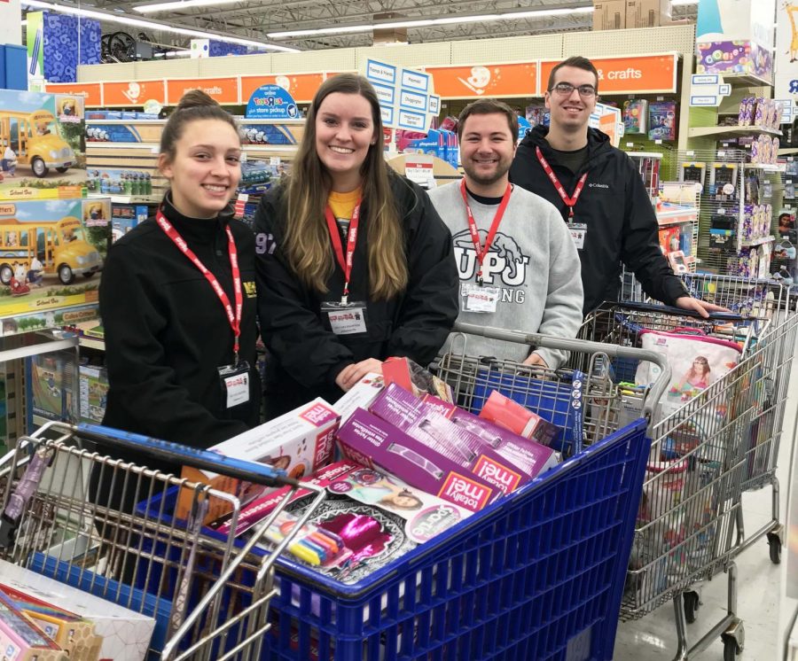 Student+government+members+%28left-right%29+Keirstin+Ward%2C+Gretchen+Sheppard%2C+Brady+Willis+and+Joe+Evanko+particapate+in+a+toy+buy+at+Toys+R+Us+Nov.+7+