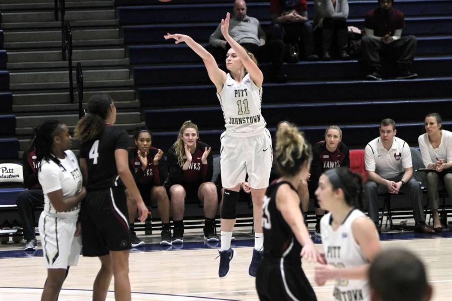 Olivia+McCabe+attempts+a+two-point+shot+against+Indiana+%28Pa.%29+University+Jan.+4+at+the+Sports+Center.+McCabe+scored+her+1%2C000th+point+in+a+Jan.+6+game+against+Gannon+University.
