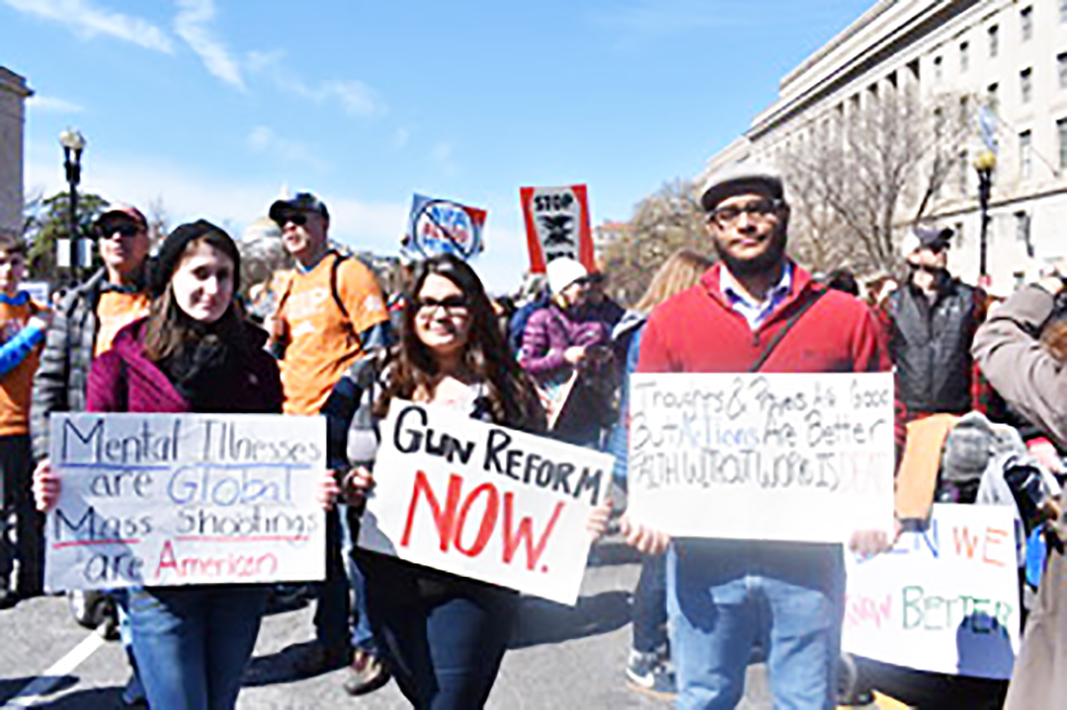Junior Kristy Speranza, freshman Maddie Brown and sophomore Chris Nichols brought signs to the national March for Our Lives last Saturday.
