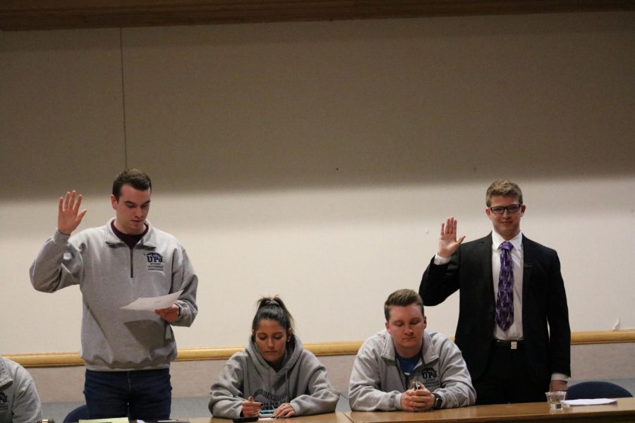 Former+student+government+President+Joe+Evanko+%28left%29+swears+in+his+successor+Sam+Miller+%28right%29+as+president.