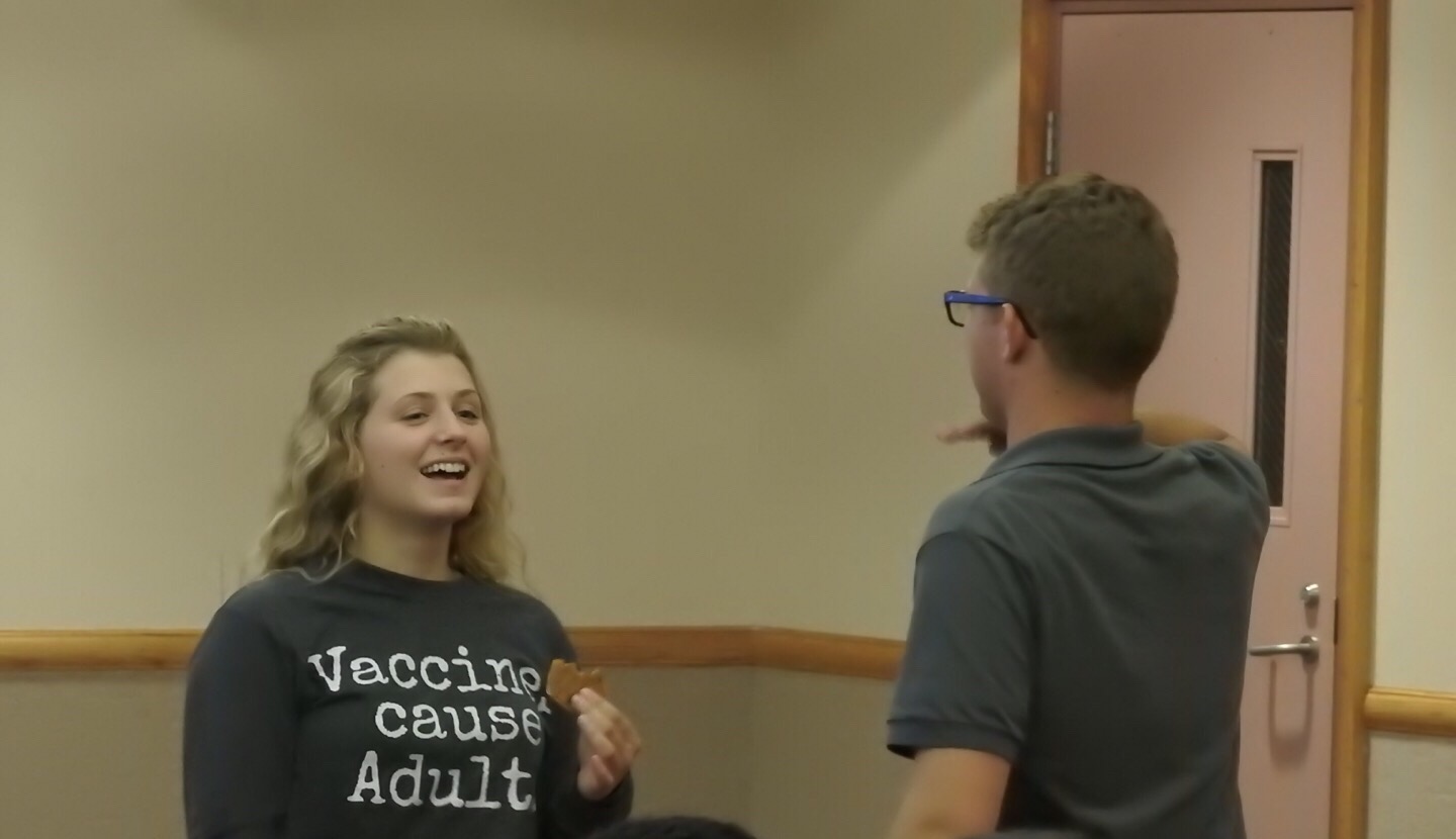 Junior Hannah Brown talks with student government President Sam Miller during an Aug. 27 meet-the-senators meeting. Brown was one of the few to attend the meeting.