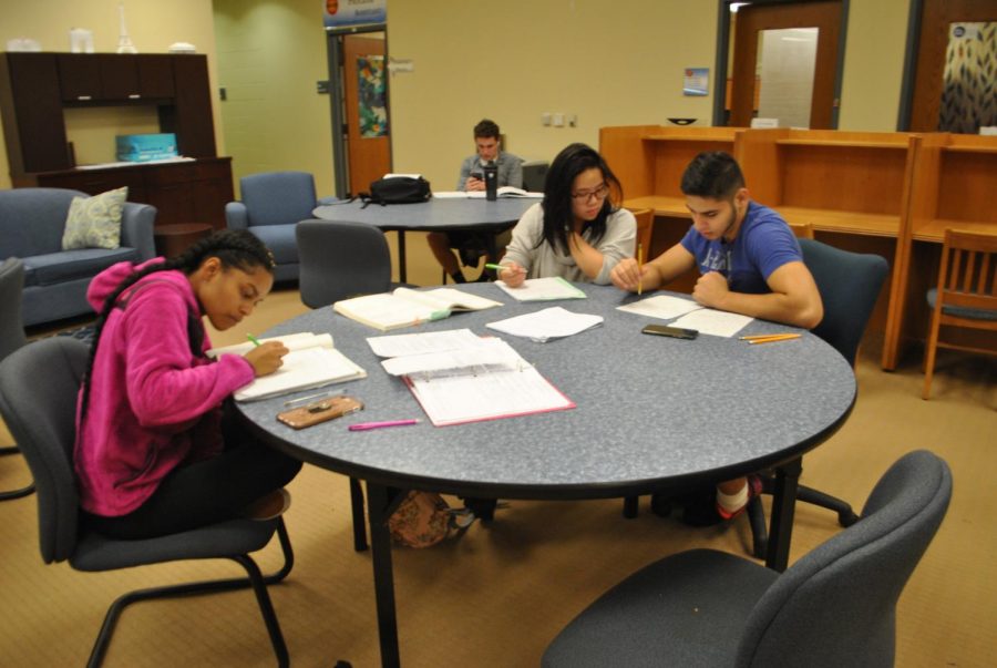 %28Left+to+right%29+Students+Jordyn+Ford%2C+Kaila+Yuazon+and+Muhammad+Quraishy+work+on+math+problems+at+drop-in+tutoring+in+the+Academic+Success+Center+last+week.+