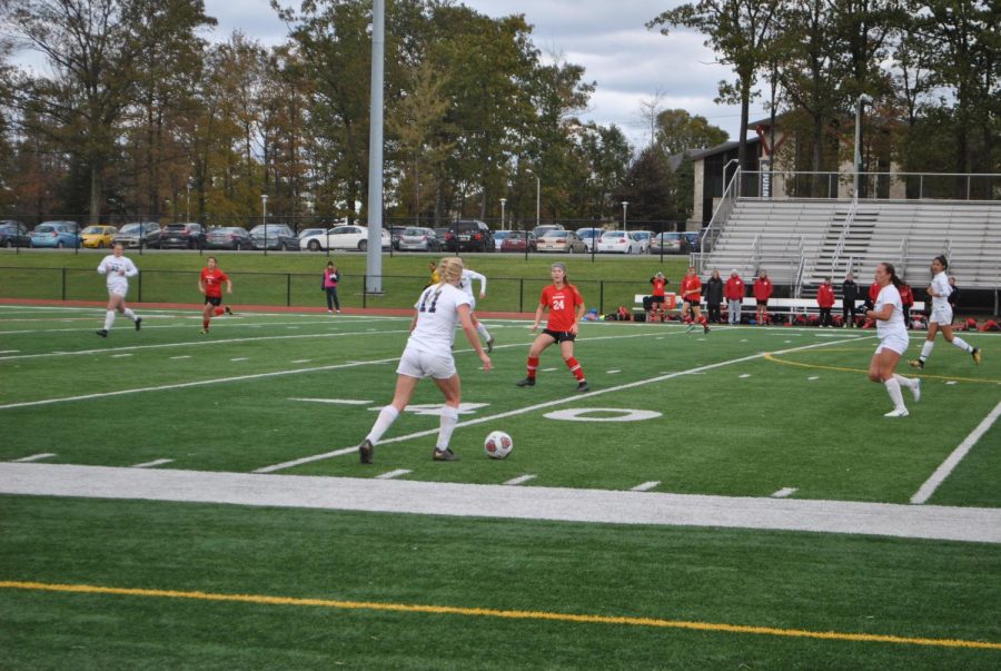 Senior+defender+Rachel+Fleming+%2811%29+posses+the+ball+against+Edinboro+last+Wednesday+at+Richland+High+School%E2%80%99s+field.+Pitt-Johnstown+lost%2C+0-1.