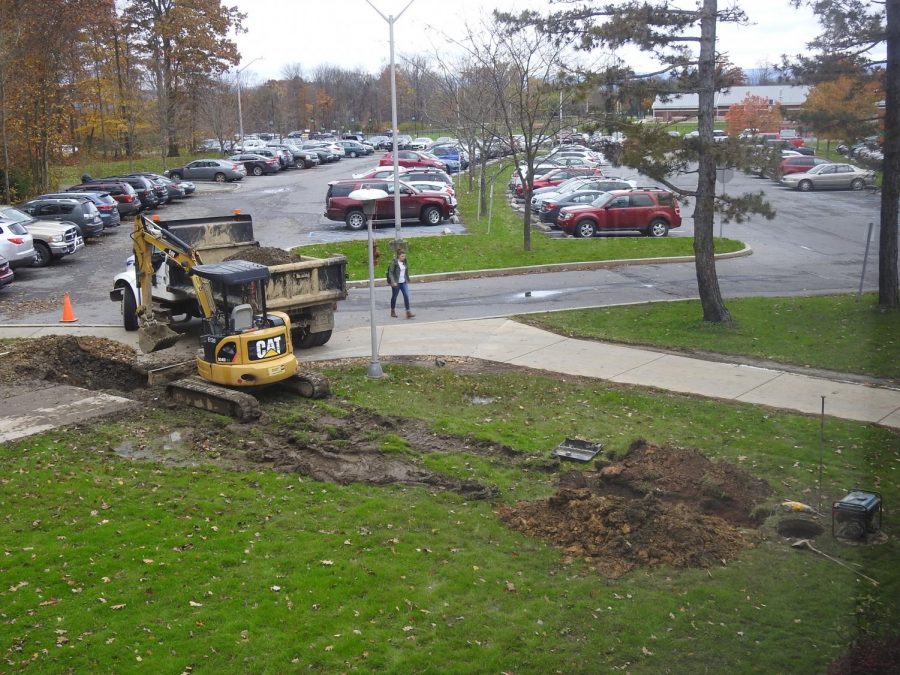 L%26M+Excavating+workers+installed+a+storm+drain+inlet+Nov.+2+to+a+drainage+system+near+a+Biddle+Hall+sidewalk+where+water+had+collected+frequently+during+storms.