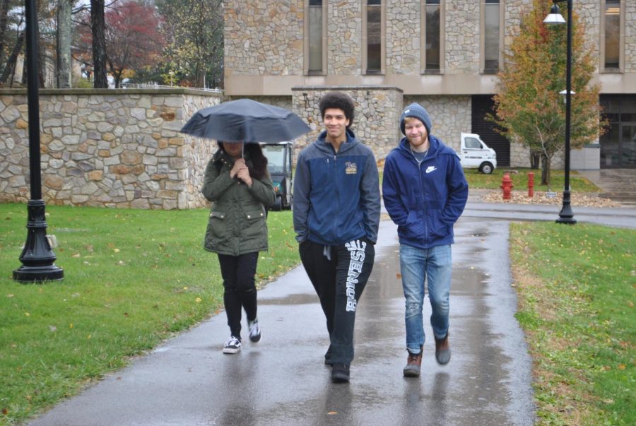 Sophomores+Chloe+Guerra%2C+Zach+Davis+and+Richard+Hartnett+brave+the+cold%2C+wind+and+rain+Friday+with+fall+jackets.+