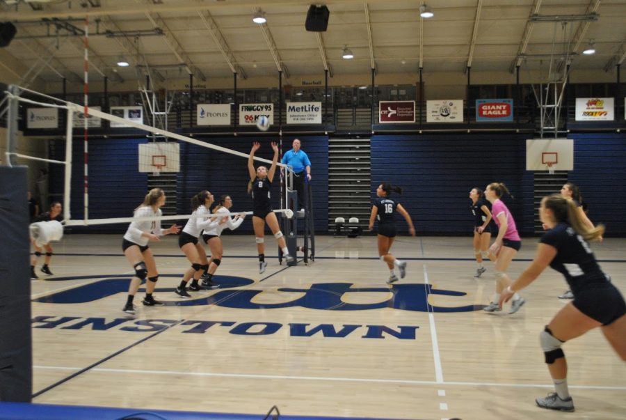 Sophomore+J.C.+Longeville+%28No.+2%2C+center%29+sets+the+ball+for+her+teammates+in+the+volleyball+team%E2%80%99s+first+round+conference+playoff+game+agsinst+California+%28Pa.%29+University+last+Wednesday+at+the+Sports+Center.+The+volleyball+players+lost+2-3.
