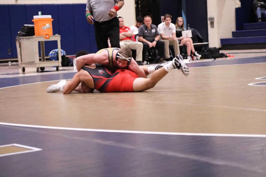 Brock+Biddle+holds+his+opponent+at+a+Jan.+11+bout+at+the+Sports+Center+against+East+Stroudsburg.