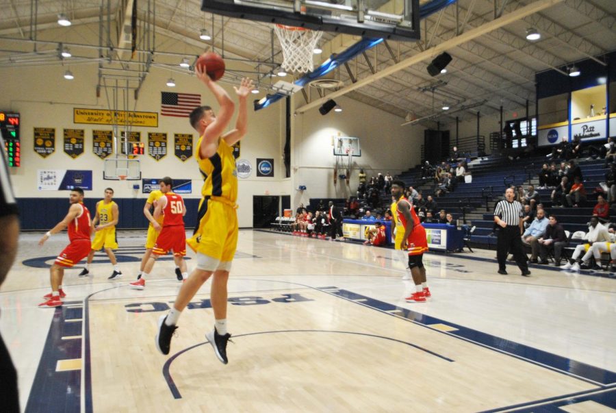 Marcin+Wiszomirski+dunks+with+no+opposing+players+under+the+backboard+against+Seton+Hill+University+on+Saturday+at+the+Wellness+Center+in+a+64-86+losing+effort.