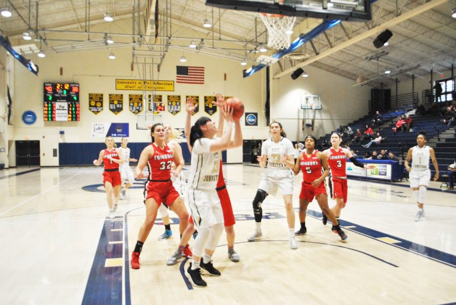 Pitt-Johnstown+junior+Alli+McGrath+%28No.13%29+attempts+to+make+a+lay-up+Saturday+against++%0AEdinboro+University+at+the+Sports+Center.+Despite+McGrath%E2%80%99s+11+points%2C+the+Mountain+Cats+lost%2C+68-63.