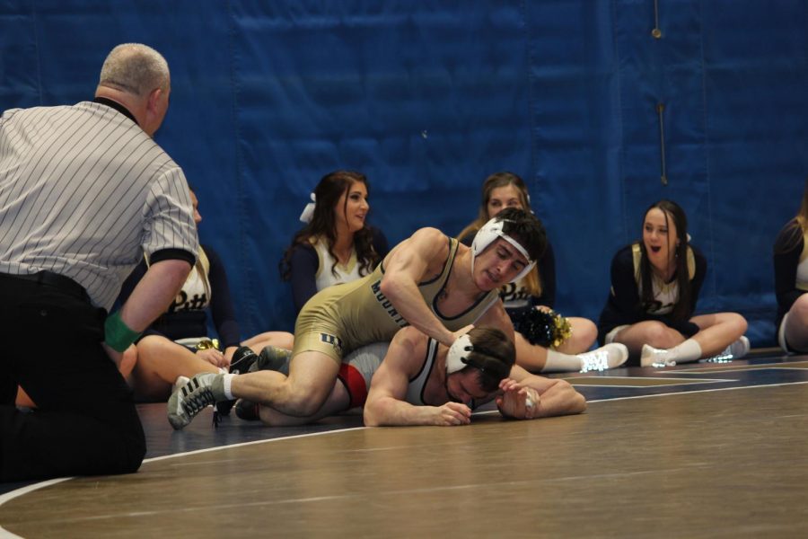 Joey+Alessandro+pushes+his+opponent+during+a+Friday+bout+at+the+Sports+Center+against+Seton+Hill+University.%0APitt-Johnstown+won+23-14+in+the+match.