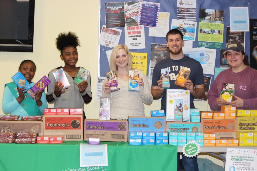 Girl+Scout+Ariyana+Mays+%28left%29%2C+junior+Madison+Kriak+%28middle%29+and+sophomore+Michael+Garancsi+%28right%29+sold+Girl+Scout+cookies+last+Friday+on+the+Student+Union+ground+floor.