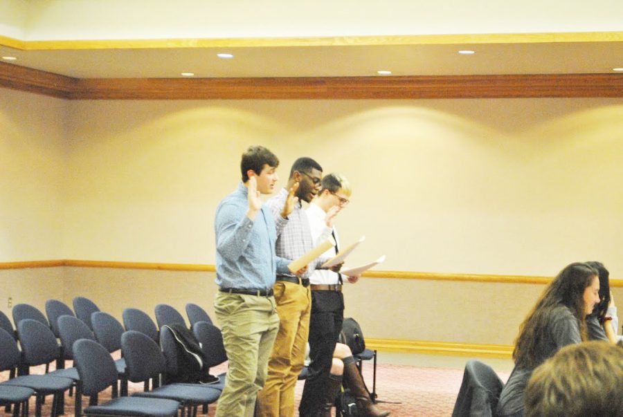 New+student+government+senators+Ryan+Clark+%28left%29%2C+Kyle+Quartes+Jr.+%28center%29+and+Brant+Durham+%28right%29+get+sworn+in+during+a+Feb.+4+meeting.